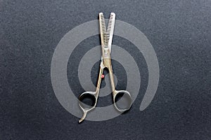 Professional opened hair scissors on black