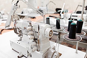 Professional overlock sewing machine in workshop