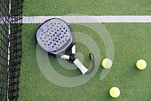professional paddle tennis racket with natural lighting on court background. Horizontal sport theme poster, greeting