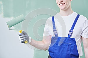 Professional painter with roller