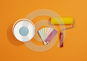 Professional painter work tools on orange background