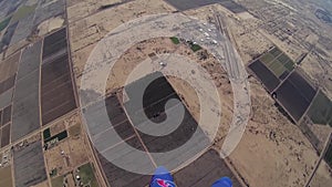 Professional parachute jumper open parachute above arizona. Scenery. Horizon.