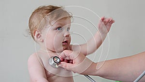 Professional Pediatrician Examining Infant