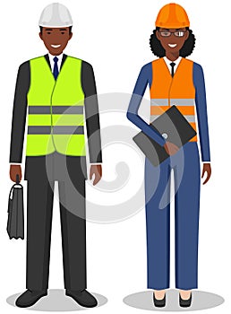 Professional people concept. Couple of african american engineers, businessman and businesswoman standing together