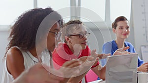 Professional people meeting in office. Business people sitting at table.