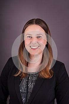 Professsional portrait of young female in Buisness suit photo
