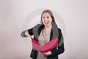 Buisness women holding open red folder excited expression photo