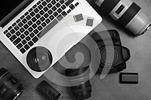 Professional photographer equipment and laptop on gray background