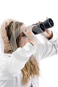 Professional photographer eyeing with binoculars
