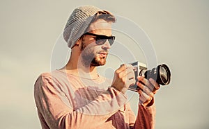 Professional photographer. Handsome photographer guy retro camera. Photojournalist concept. Guy photographer outdoors
