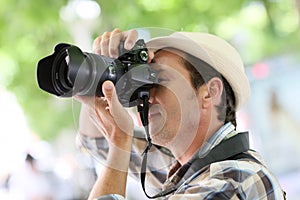 Professional photographer shooting outdoors