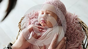 Professional Photographer Soothing A Newborn Baby For Photo Session