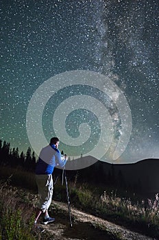 Professional photographer taking photos of Milky Way.