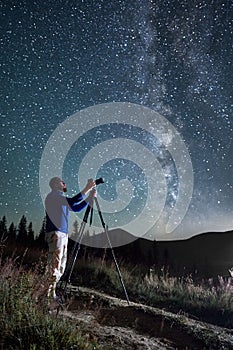 Professional photographer taking photos of Milky Way.