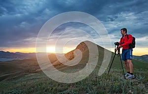 Professional photographer using a tripod, taking a photo