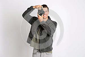 Professional photographer working on white in studio