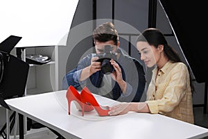 Professional photographers shooting stylish shoes