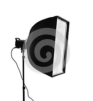 A professional photographic studio flash with a rectangular softbox mounted on a stand