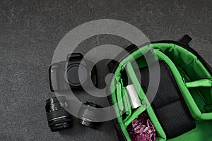 Professional Photography Gear : camera and lenses, blue wireless on grunge gray background