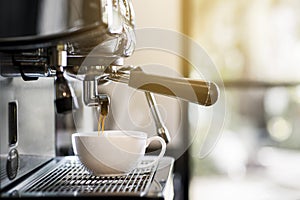 Professional   photos of coffee machines that are filling coffee into a cup photo
