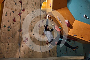 Professional physically challenged boulderer training hard after warming up