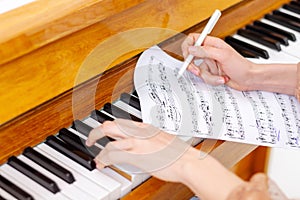 Professional pianist arranging piano music