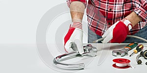 Professional plumber banner with plumber and tools, fitting and water tap.