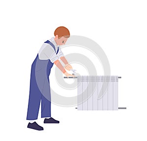 Professional plumber installing, servicing and adjusting heating radiator isolated on white