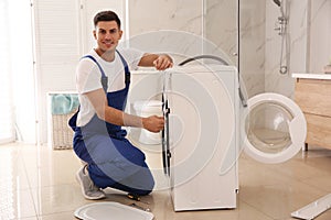 Professional plumber repairing washing machine