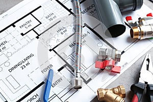 Professional plumber`s supplies on house plan