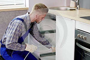 Professional Plumber Using Plunger to Unclog Drain: Cleaning photo