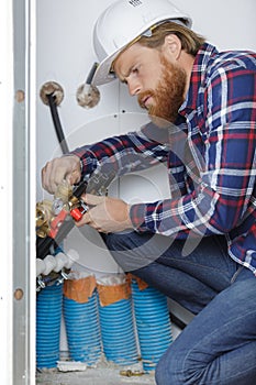 professional plumber work on pipe