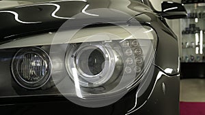 After professional polishing, ceramics and car washes show headlights on new cars. Concept of: Auto Service, Different Colors, Car