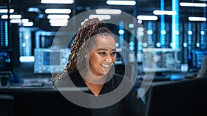 Professional IT Programer Working in Data Center on Desktop Computer with Two Displays, while Doin