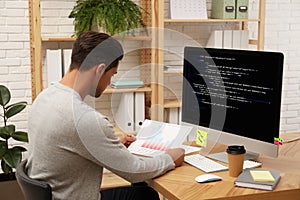 Professional programmer working with computer