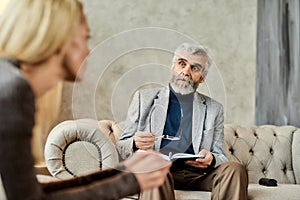Professional psychoanalyst listening to depressed woman
