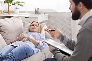 Professional psychologist is conducting consultation to stressful patient