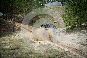 Professional quad biker rides fast on sand. Quad racing, ATV 4x4