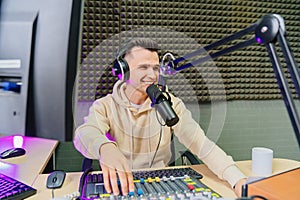 professional radio presenter with mixing console. r