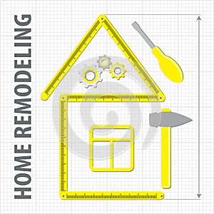 Professional Remodeling Home. Silhouette of a house from a yellow building ruler. Set of repair tools on a sheet in a cage. photo