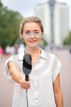 Professional reporter beautiful girl standing on