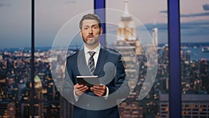 Professional reporter hosting breaking news at modern television studio closeup.