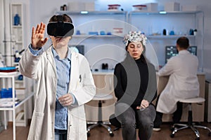Professional researcher wearing virtual reality glasses using medical inovation photo
