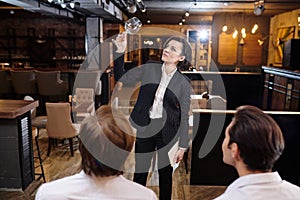 Professional restaurateur examining cleanliness of wineglass