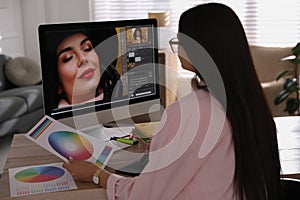 Professional retoucher working on computer