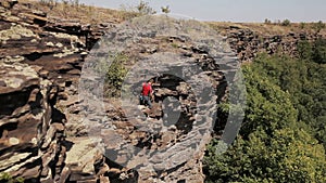 Professional rock climber on a cliff