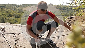 Professional rock climber on a cliff