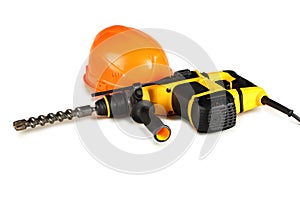 Professional rotary hammer drill and a construction helmet