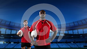 Professional rugby players standing in front of a stadium