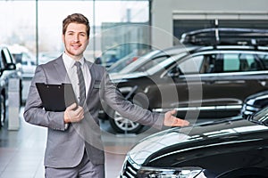 Professional sale assistant working in auto show